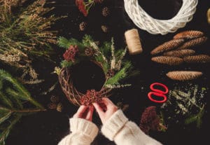 woman-white-sweater-making-christmas-wreath_87910-3545